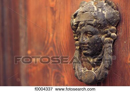 Stock Photo - object, objects, metal, door knocker, door handle, face, detail. Fotosearch
