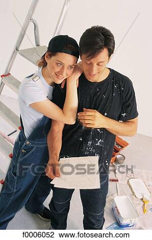 Stock Image - odd jobs, couple, woman, women, people, inside. Fotosearch