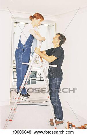 odd jobs, couple, woman, women, people, inside View Large Photo Image Stock Photo - odd jobs, couple, woman, women, people, inside. Fotosearch