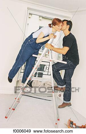 odd jobs, couple, woman, women, people, inside View Large Photo Image Stock Photo - odd jobs, couple, woman, women, people, inside. Fotosearch