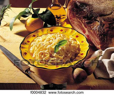 Stock Image - pasta, knife, ham, gastronomy, food, cooked dish, Provence Alpes Cote d'Azur. Fotosearch
