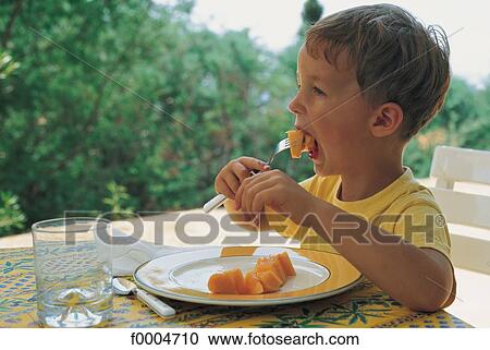 Stock Image - people, child, children, boy, meal, eat, eating. Fotosearch