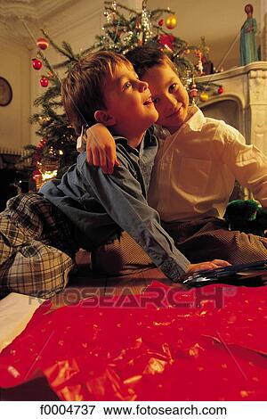 Stock Photo - people, child, children, boy, Christmas, Xmas, Christmas tree. Fotosearch