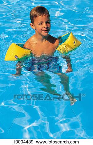 Stock Photo - people, child, children, boy, swimming pool, smile, smiling. Fotosearch