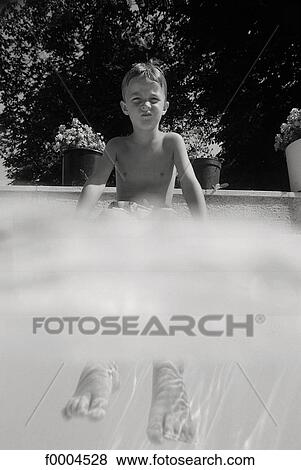 Stock Photo - people, child, children, boy, swimming pool, sitting, sulky. Fotosearch