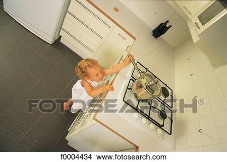 people, child, children, girl, inside, indoors, kitchen View Large Photo Image Picture - people, child, children, girl, inside, indoors, kitchen. Fotosearch