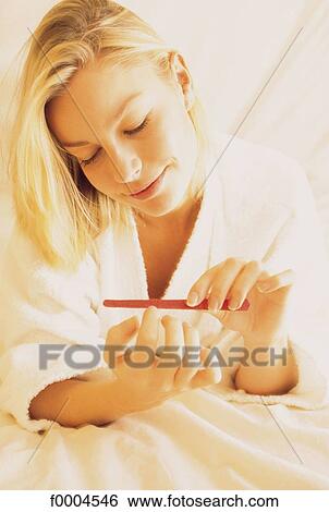 people, woman, women, beauty, robe, manucure, nail file View Large Photo Image Stock Photograph - people, woman, women, beauty, robe, manucure, nail file. Fotosearch