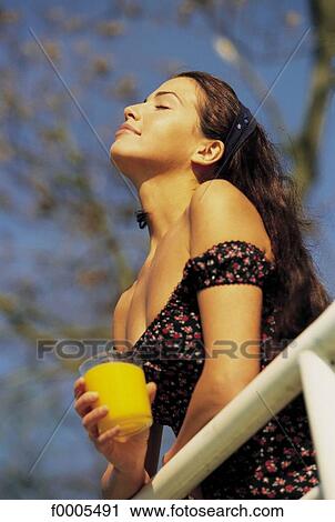 people, woman, women, dark hair, dark-haired, orange juice View Large Photo Image Stock Image - people, woman, women, dark hair, dark-haired, orange juice. Fotosearch