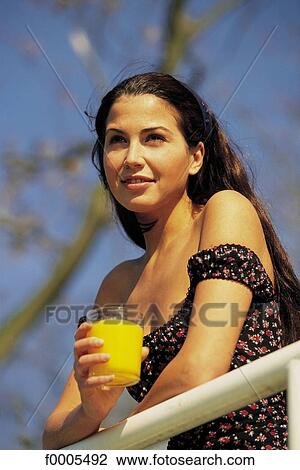 people, woman, women, dark hair, dark-haired, orange juice View Large Photo Image Stock Image - people, woman, women, dark hair, dark-haired, orange juice. Fotosearch