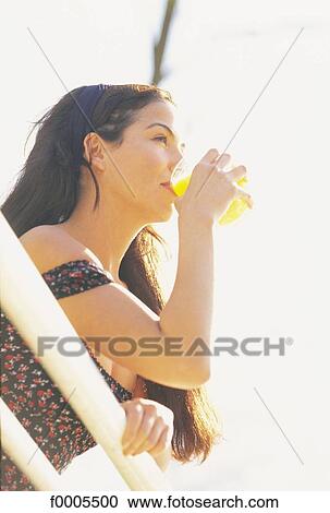 people, woman, women, dark hair, dark-haired, orange juice View Large Photo Image Stock Image - people, woman, women, dark hair, dark-haired, orange juice. Fotosearch
