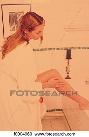 Stock Image - people, woman, women, inside, indoors, bathroom. Fotosearch
