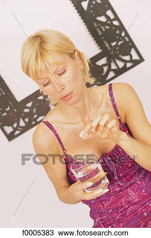 Stock Image - people, woman, women, inside, indoors, blond hair. Fotosearch