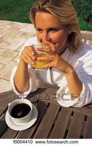 people, woman, women, robe, breakfast, cup of coffee, orange juice View Large Photo Image Stock Image - people, woman, women, robe, breakfast, cup of coffee, orange juice. Fotosearch