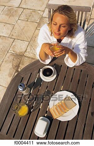people, woman, women, robe, breakfast, cup of coffee View Large Photo Image Stock Image - people, woman, women, robe, breakfast, cup of coffee. Fotosearch