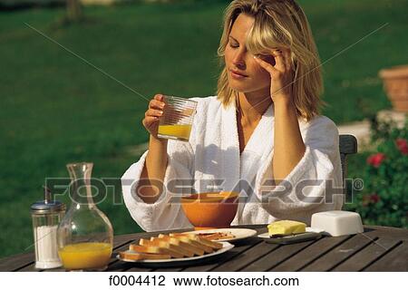 Stock Image - people, woman, women, robe, breakfast, bowl of coffee. Fotosearch