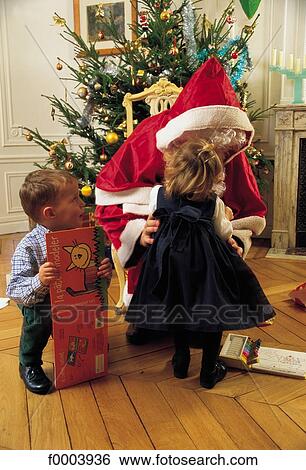 Santa Claus, child, children, people, girl, boy, celebration View Large Photo Image Stock Photograph - Santa Claus, child, children, people, girl, boy, celebration. Fotosearch
