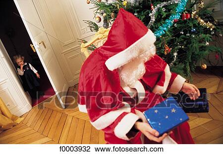 Santa Claus, Christmas, Xmas, gift, offer, present, people View Large Photo Image Stock Image - Santa Claus, Christmas, Xmas, gift, offer, present, people. Fotosearch