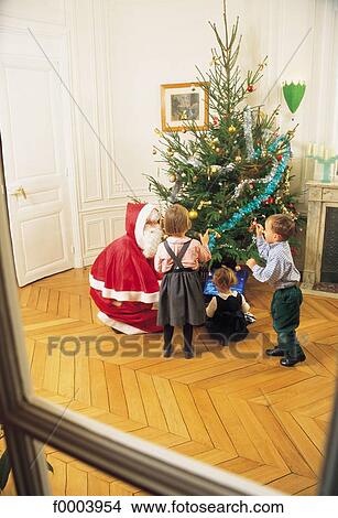 Santa Claus, tradition, child, children, people, Christmas, Xmas View Large Photo Image Picture - Santa Claus, tradition, child, children, people, Christmas, Xmas. Fotosearch