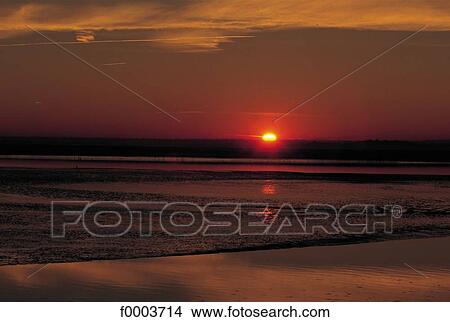 sea, sunset, setting sun, sun, coastal landscape, coast, littoral View Large Photo Image Picture - sea, sunset, setting sun, sun, coastal landscape, coast, littoral. Fotosearch