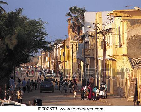 Stock Image - street, Africa, Senegal, group, crowd, house, traditional architecture. Fotosearch