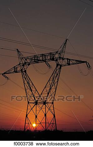 sunset, setting sun, pylon, industry, electricity, energy, high voltage View Large Photo Image Stock Photo - sunset, setting sun, pylon, industry, electricity, energy, high voltage. Fotosearch