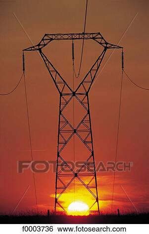 sunset, setting sun, pylon, industry, energy, electricity, high voltage View Large Photo Image Stock Photograph - sunset, setting sun, pylon, industry, energy, electricity, high voltage. Fotosearch