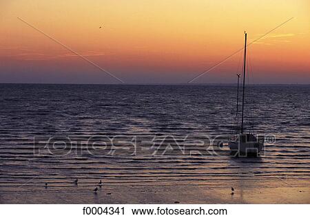 sunset, setting sun, sky, skyline, boat, sailing boat, leisure boat View Large Photo Image Stock Image - sunset, setting sun, sky, skyline, boat, sailing boat, leisure boat. Fotosearch