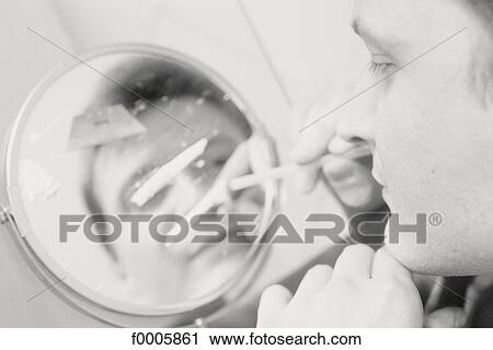 Stock Image - teenage boy, inside, indoors, drug, hard drug, cocaine. Fotosearch