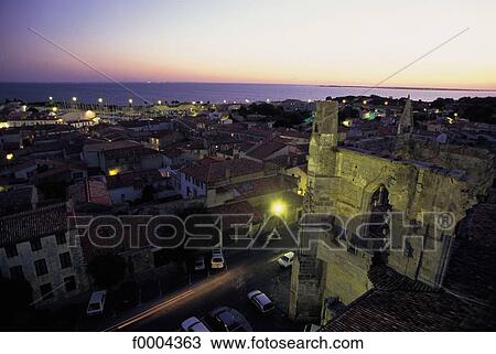 Stock Image - town, city, general view, lighting, light, night, Charente Maritime. Fotosearch