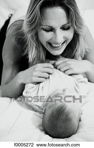 Stock Image - woman, women, family, people, baby, tenderness, affection. Fotosearch