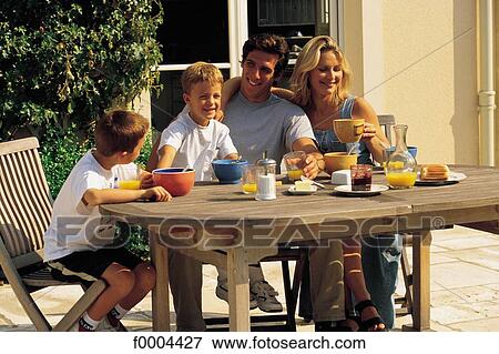 Stock Photo - woman, women, people, child, children, boy, breakfast. Fotosearch