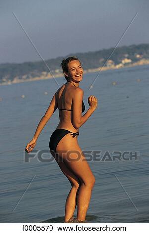 Stock Image - woman, women, people, dark hair, dark-haired, swimming costume. Fotosearch