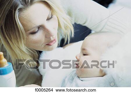 Picture - woman, women, people, family, baby, tenderness, affection. Fotosearch