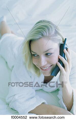 Stock Image - woman, women, people, robe, phoning, on the phone, phone ctelephone ctelephony. Fotosearch