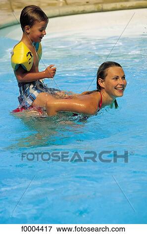 woman, women, people, swimming pool, swimming costume, child View Large Photo Image Stock Photo - woman, women, people, swimming pool, swimming costume, child. Fotosearch