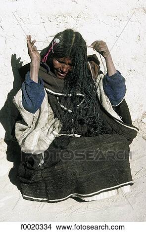 Picture - Bolivia, Santa Ana de Chipaya, hair plaiting. Fotosearch