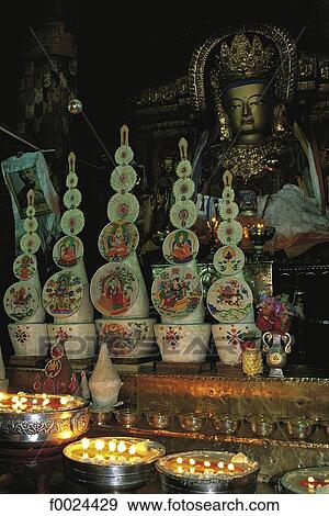 Stock Photo - China, Tibet, Gyantse, Pelkor Chode Monastery, statue of Sakyamuni Buddha and tormas (ritual cakes). Fotosearch