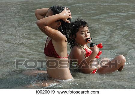 Costa Rica, Manuel Antonio National park, two young girls bathing View Large Photo Image Stock Photo - Costa Rica, Manuel Antonio National park, two young girls bathing. Fotosearch