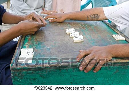 Egypt, between Qina and Luxor, men playing dominoes View Large Photo Image Stock Image - Egypt, between Qina and Luxor, men playing dominoes. Fotosearch