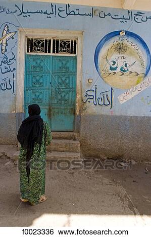 Egypt, between Qina and Luxor, decorated house and woman View Large Photo Image Stock Photograph - Egypt, between Qina and Luxor, decorated house and woman. Fotosearch