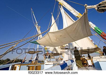 Egypt, near Luxor, aboard a cruise felucca View Large Photo Image Stock Photo - Egypt, near Luxor, aboard a cruise felucca . Fotosearch