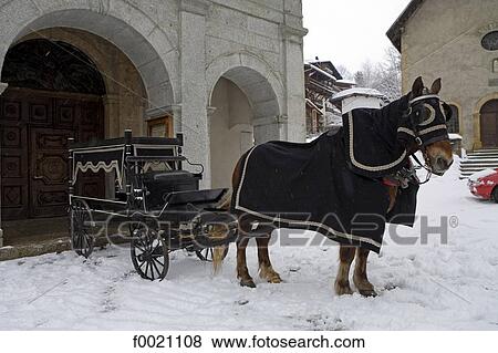 Stock Photo - France, Alps, Megeve, burial horsecart. Fotosearch