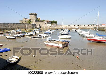 Stock Photo - France, Aquitaine, Ciboure, Socoa Harbour, harbour at low tide and fort. Fotosearch