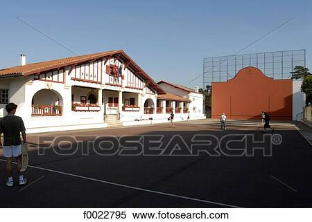 France, Aquitaine, Guéthary, city hall and fronton of Basque pelota View Large Photo Image Stock Photography - France, Aquitaine, Guéthary, city hall and fronton of Basque pelota. Fotosearch