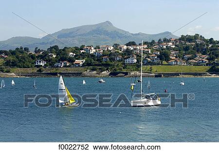 Stock Image - France, Aquitaine, Saint Jean de Luz Bay, boats and La Rhune. Fotosearch