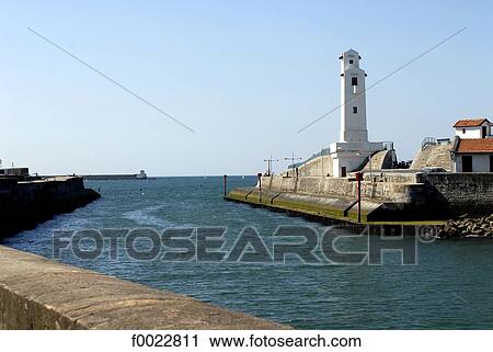 Stock Image - France, Aquitaine, Saint Jean de Luz, entrance of the harbour. Fotosearch