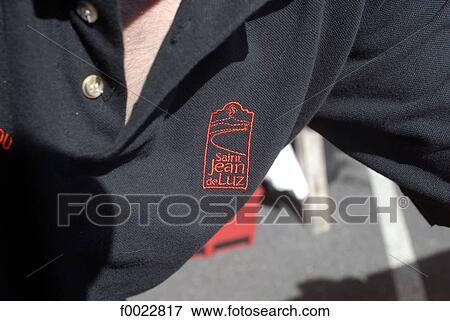 Stock Photo - France, Aquitaine, Saint Jean de Luz, escutcheon embroidered on a garment. Fotosearch