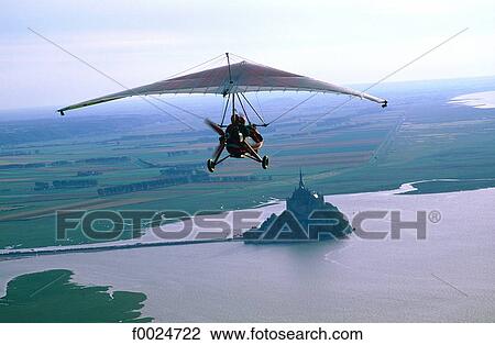 France, Normandy, ultralight plane flying over Mont Saint-Michel View Large Photo Image Stock Image - France, Normandy, ultralight plane flying over Mont Saint-Michel. Fotosearch