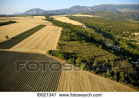 France, Provence, Valensole plateau, wheat fields, aerial view View Large Photo Image Stock Photo - France, Provence, Valensole plateau, wheat fields, aerial view. Fotosearch