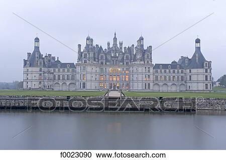 Stock Image - France, Touraine, Chambord, castle along the river. Fotosearch